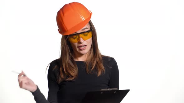 Female construction engineer. Woman builder isolated portrait with protect helmet