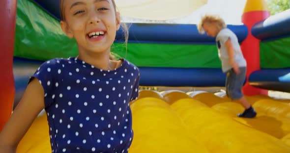 Kids playing on the bouncing castle 4k