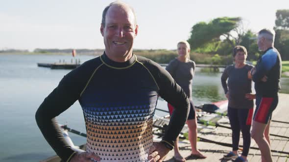 Portrait of senior caucasian man and teammates in background