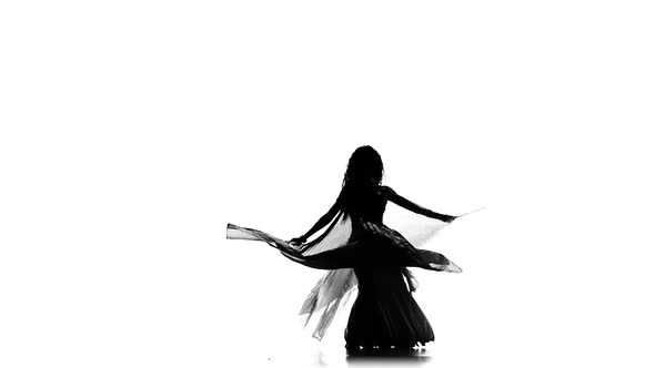 Talanted Exotic Belly Dancer Woman Go on Dance, Uses Wings, on White, Slow Motion, Silhouette