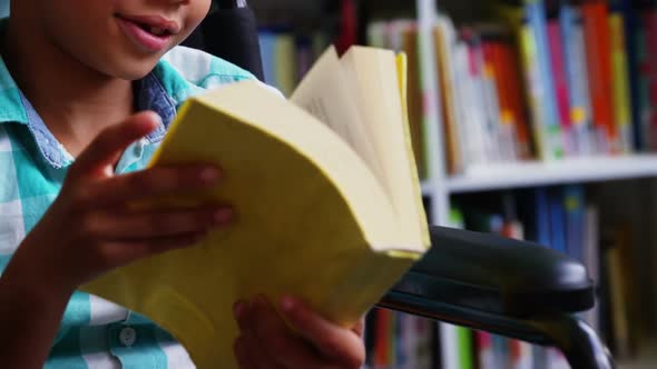 Disabled Schoolboy Reading Book