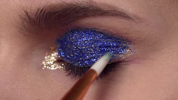 Glitter Are Applied To the Woman's Eyelid, Making of the Evening Makeup, Eyes Makeup, Makeup Artist