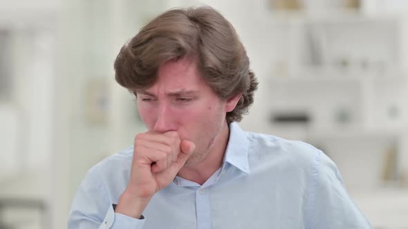 Portrait of Sick Young Businessman Coughing Allergic