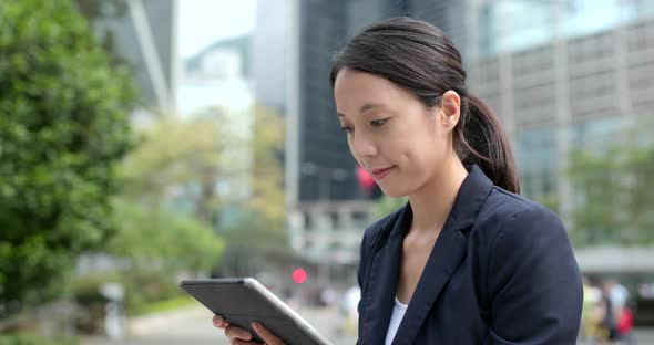 Businesswoman look at the digital tablet computer