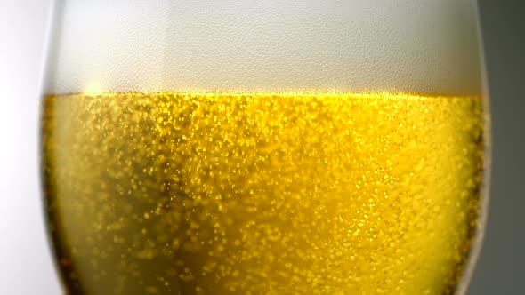 Extreme close-up beer bubbles in a glass, Slow Motion