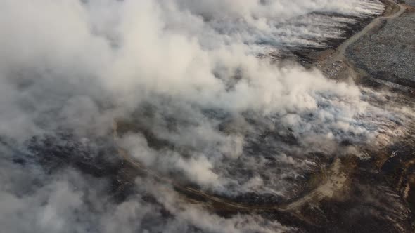 Aerial view fire burning happen at landfill site