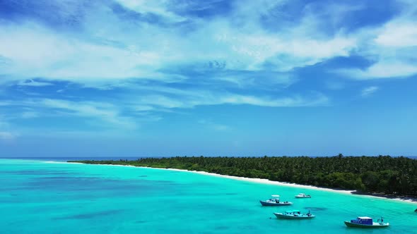 Aerial top down panorama of exotic coastline beach journey by shallow ocean with white sand backgrou