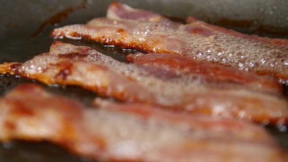 Sizzling Crispy Bacon Frying in a Pan