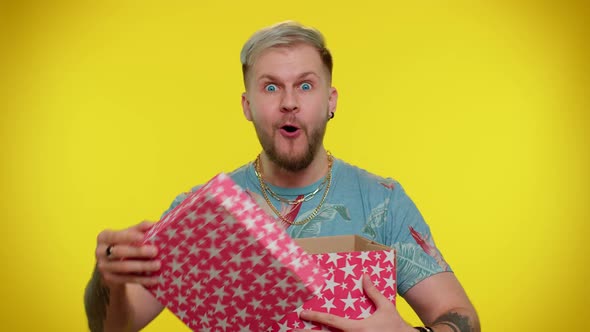 Cheerful Tourist Young Man Opening Gift Box Great Happiness Amazement Satisfied with Best Present