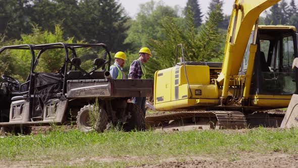 Workers get out of utility vehicle and walk to jobsite alt