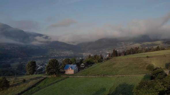 Foggy Sunrise in Mountainous Countryside