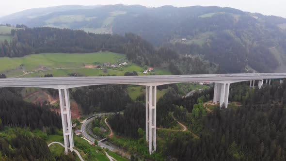 Aerial View of the Highway Viaduct on Concrete Pillars in the Mountains