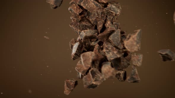 Super Slow Motion Shot of Raw Chocolate Chunks Side Crashing at 1000 Fps.