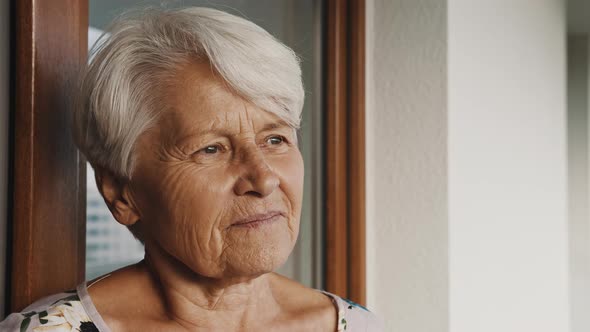 Portrait of Senior Gray Haired Woman Looking in the Distance