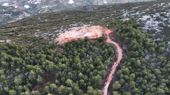 Road in the forest high in the mountains aerial view 4 K