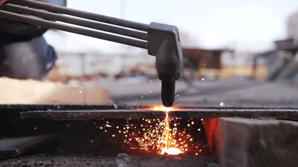 gas cutting of metal, sparks fly