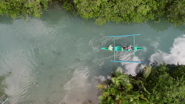 Aerial view of traditional fishing boat in Bojo River, Aloguinsan, Philippines.