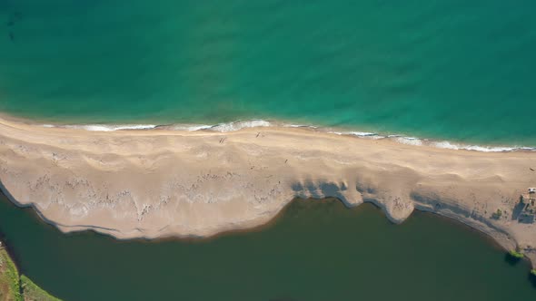 Exotic sandy beach surrounded by sea and river