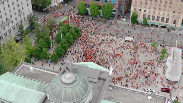 Protesters March in the Streets to Demand Justice, Aerial View Moving Forward. Indigenous people in