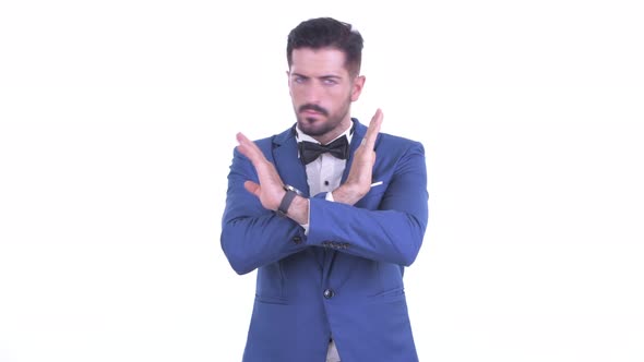 Serious Young Bearded Businessman with Stop Gesture