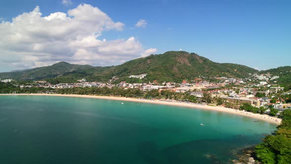 aerial drone of a beautiful white sand beach and clear turquoise water at Karon beach in Phuket Thai