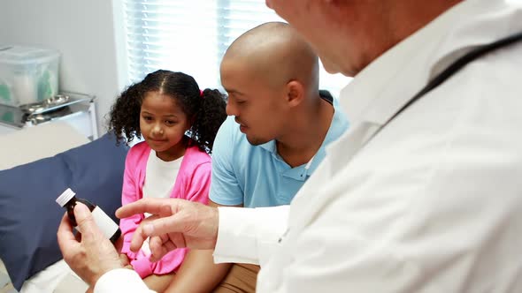 Male doctor prescribing medicine to patient