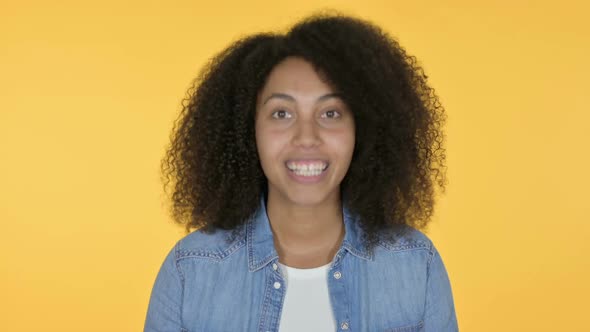 Online Video Chat By African Woman Yellow Background