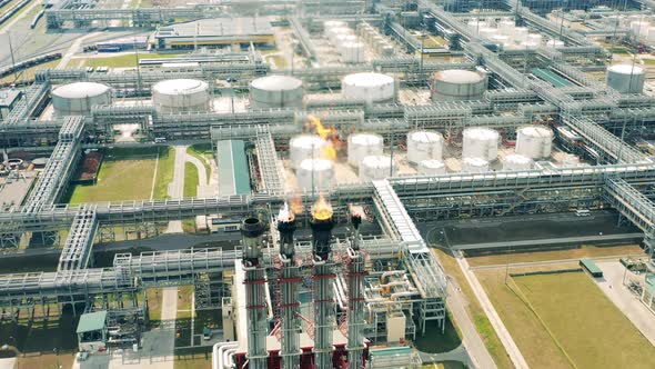 Top View of Flare Stacks and Metal Pipes of the Oil Refinery