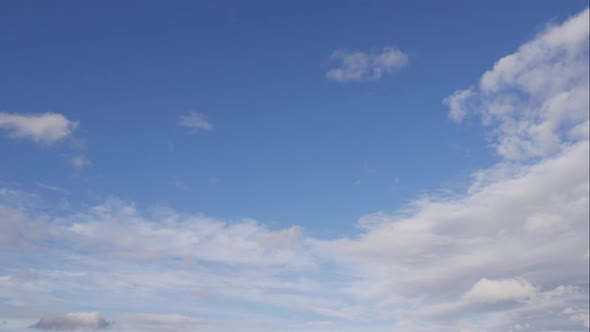 Blue Sky White Clouds. Puffy Fluffy White Clouds. Cumulus Cloud Scape Timelapse. Summer Blue Sky