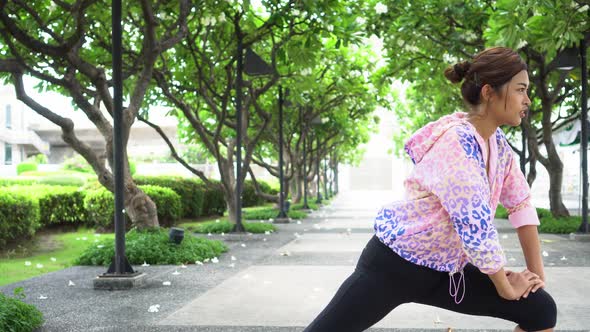 Asian Woman Stretching at Park