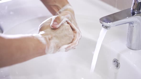 Man Wash Hands with Soap