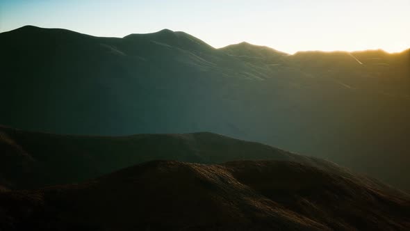 Hills with Rocks at Sunset