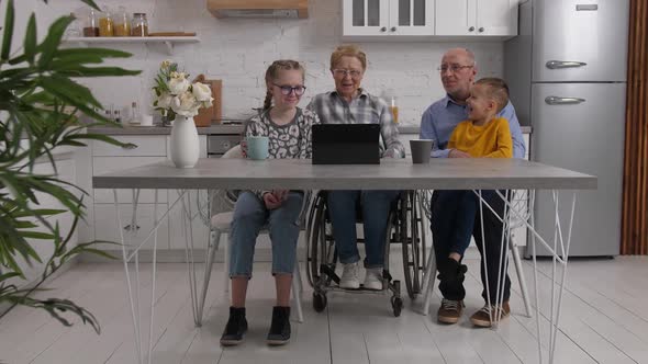 Grandparents with Grandchildren Watching Movie