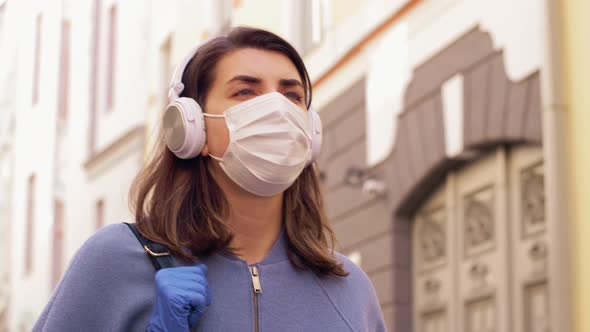 Woman Wearing Medical Mask and Gloves in City