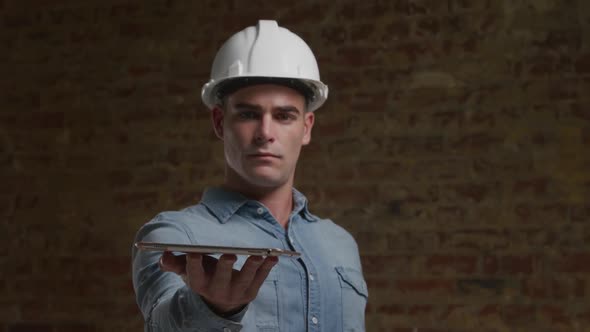 Male architect holding tablet