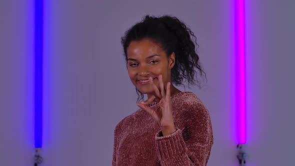 Portrait of Afro American Young Woman Smiling and Making Sign Ok