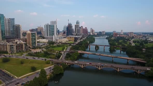 AERIAL: Pulling back from downtown Austin, Texas on a beautiful sunny day.