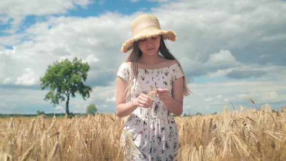 Girl Walking on Barley Field