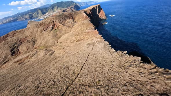 FPV Racing Drone Mountain Surfing and Cliff Diving Along the Rocks