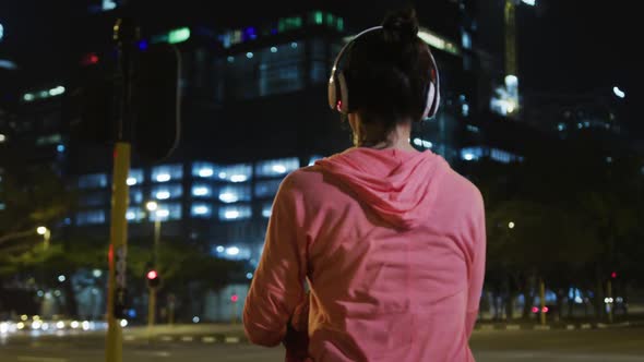 Young woman stretching before running