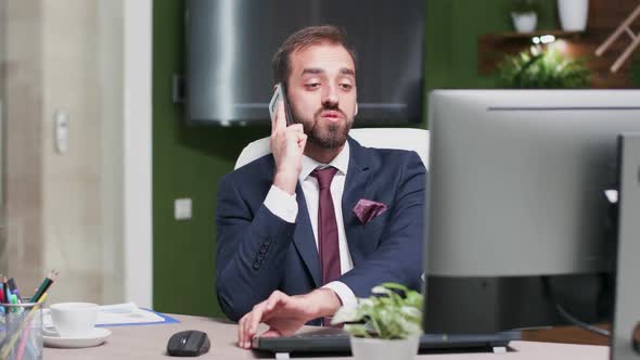 Office Worker Has a Talk on the Phone