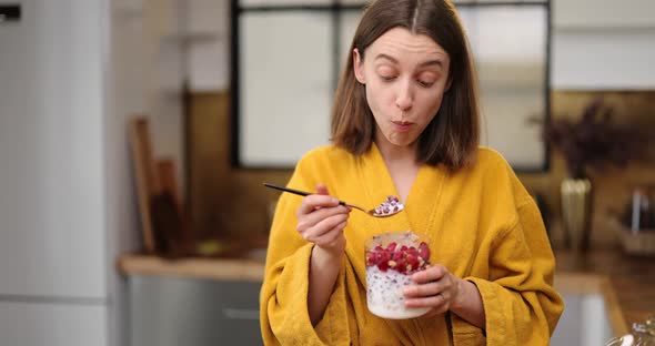 Hungry Woman Having a Breakfast at Home