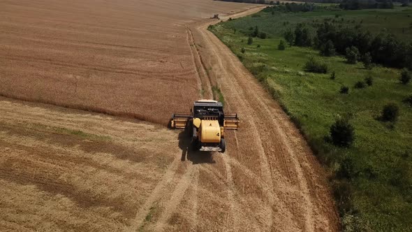 Aerial View of Combine Harvesters Agricultural Machinery. The Machine for Harvesting Grain Crops