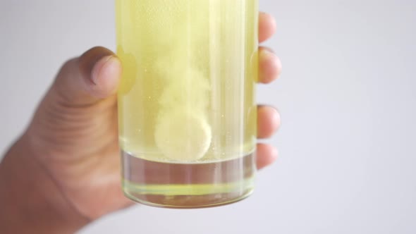 Effervescent Soluble Tablet Pills in a Glass of Water