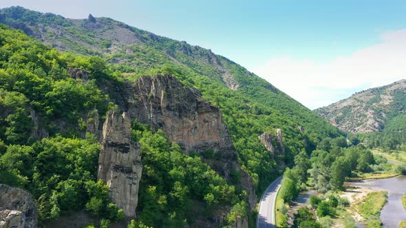 Drone Flight Over Mountains And Country Road In Summer Day