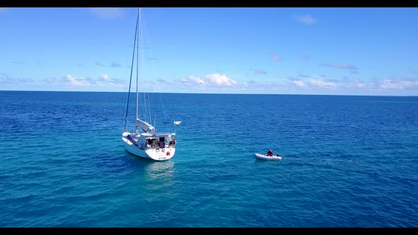 Aerial top down scenery of luxury bay beach wildlife by blue ocean with clean sandy background of jo