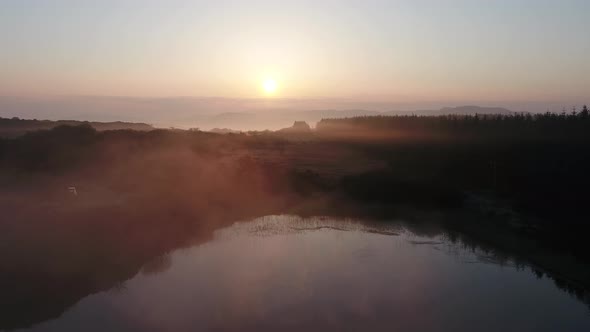 Beautiful Sunrise Above Peatbog in County Donegal with Fog  Ireland