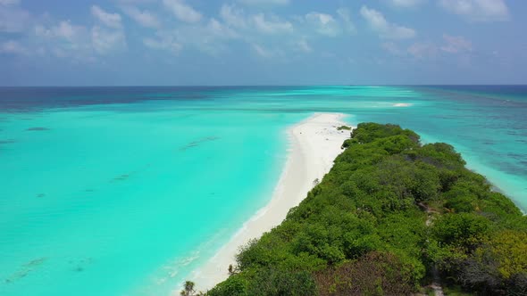 Daytime above island view of a sandy white paradise beach and turquoise sea background in high resol