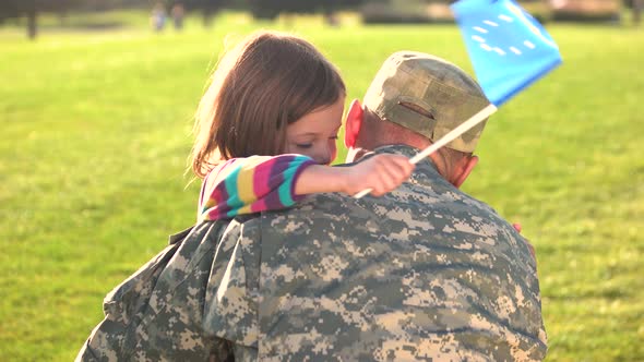 European Little Girl Embracing Her Father.