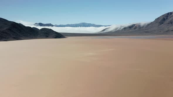 Aerial View of a Drone Flying Above Smooth Plain Cracked Surface of Death Valley